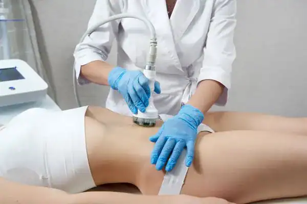 Weight Loss to Skin Confidence 2 Hi-Fu Body treatment woman having treatment on her stomach to help with saggy skin after weight loss